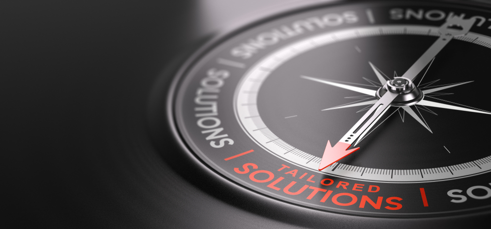 close up of a compass with a red arrow pointing to solution